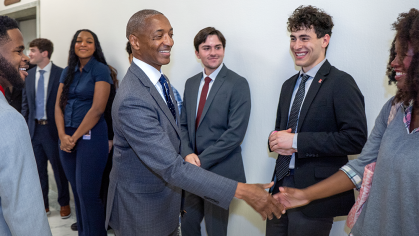 President William F. Tate IV meets the Rutgers Scarlet Service students serving in Washington, D.C.